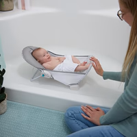 Ingenuity Foldaway 2-Position Baby Bath Seat, Adjustable Support for Sink or Bathtub, Ages 0-6 Months up to 20 Pounds, Machine-Washable Sling thumbnail 2
